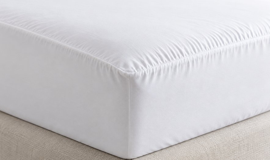White fitted sheet on a mattress