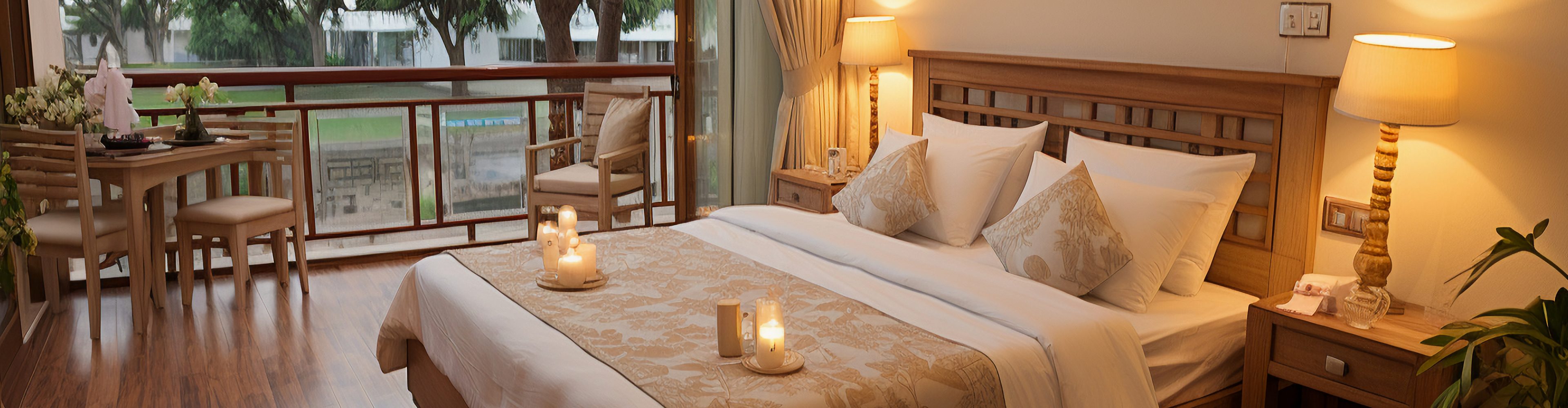 Hotel bedroom with white bed linens
