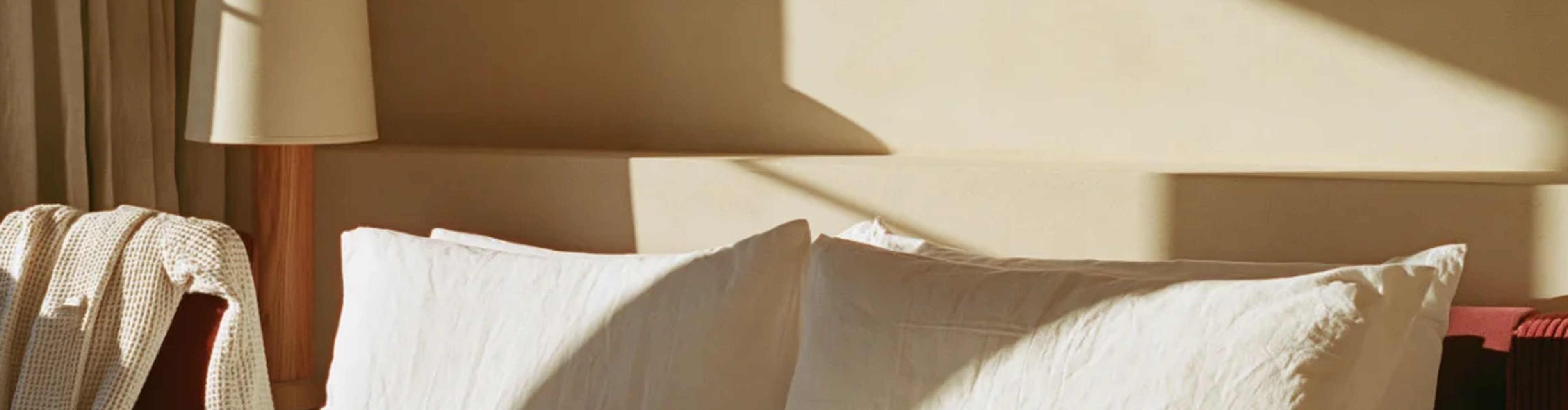 Hotel bedroom with layered bed linen